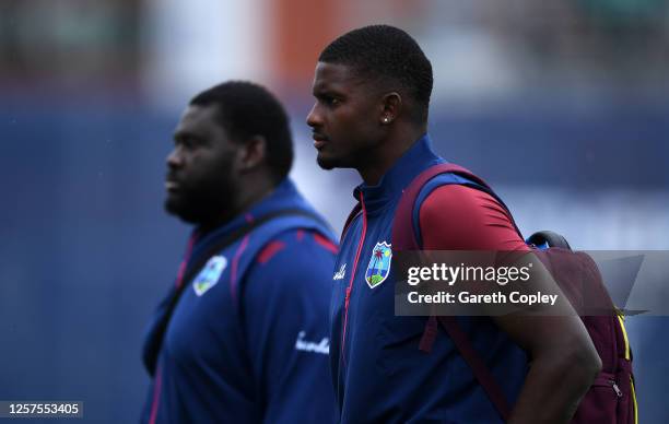 West Indies captain Jason Holder arrives with Rahkeem Cornwall during a West Indies Nets Session at Emirates Old Trafford on July 22, 2020 in...