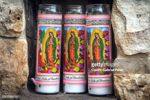 three prayer candles - virgin of guadalupe stockfoto's en -beelden