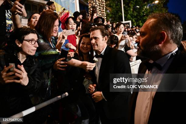 Actor Matt Dillon meets with members of the audience after the screening of the film "Asteroid City" during the 76th edition of the Cannes Film...