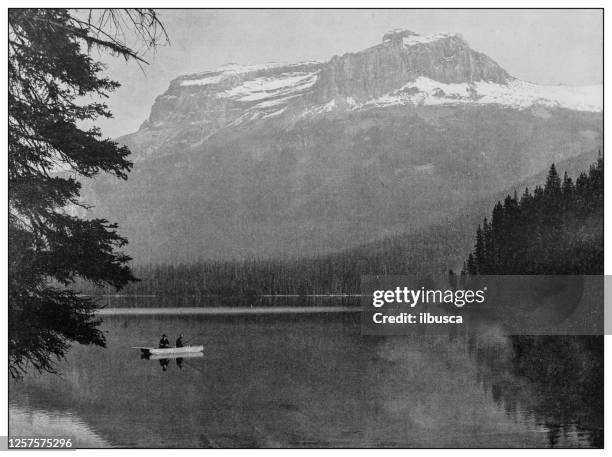 antique black and white photo: emerald lake, british columbia - emerald lake stock illustrations