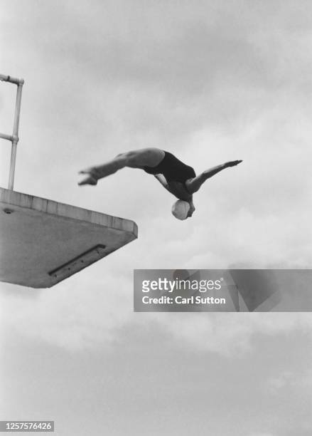 British diver Kay Cuthbert training at Croydon swimming pool, London, UK, 1948. Original publication: Picture Post - 4866 - unpub.