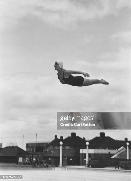 British diver Kay Cuthbert training at Croydon swimming pool, London, UK, 1948. Original publication: Picture Post - 4866 - unpub.