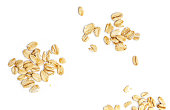 Oat flakes isolated on white background. Pile of oatmeal top view