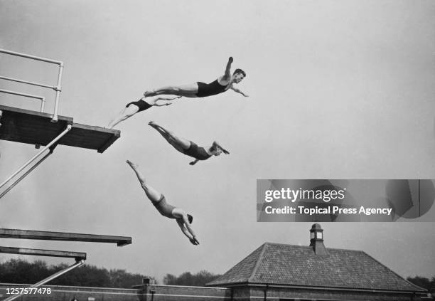 High diving display by members of the Highgate Diving Club following the new opening of the 'East End Lido' in Victoria Park, London, UK, 16th May...