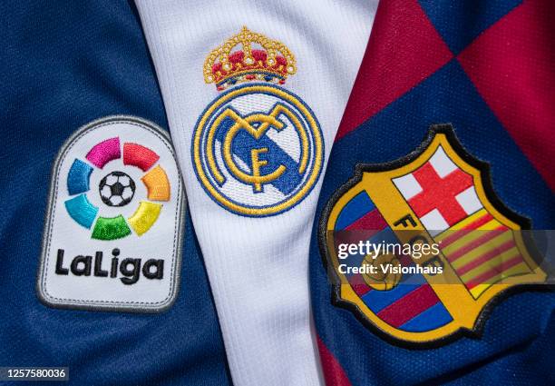 The FC Barcelona and Real Madrid club crests on the first team home shirts witht the La Liga logo on July 22, 2020 in Manchester, United Kingdom.