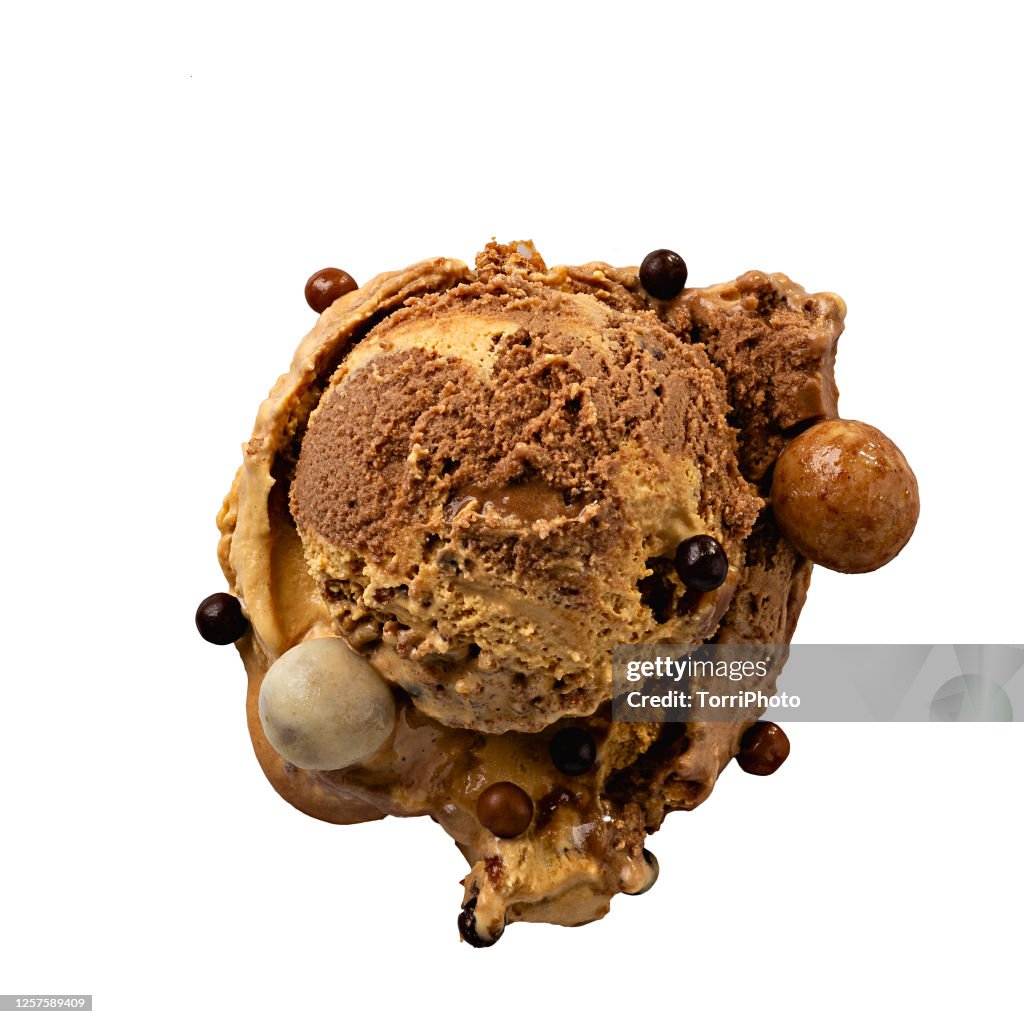Top view of chocolate and caramel gelato scoop with crispy balls isolated on white