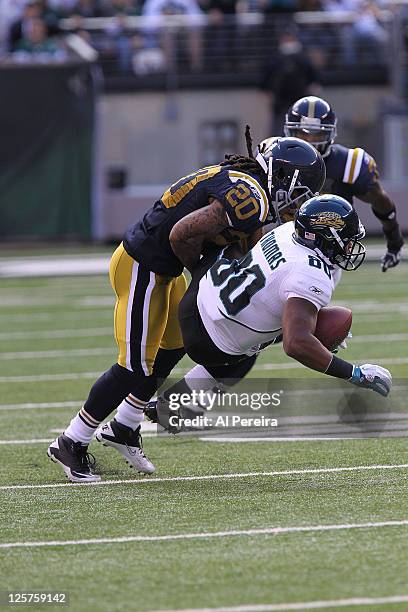 Cornerrback Kyle Wilson of the New York Jets makes a stop against the Jacksonville Jaguars when the Jets host the Jaguars at MetLife Stadium on...
