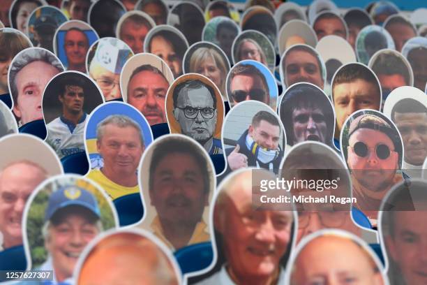 Cardboard cut out of Marcelo Bielsa, Manager of Leeds United seen in between cardboard cut outs with photos of fans displayed on the stands prior to...