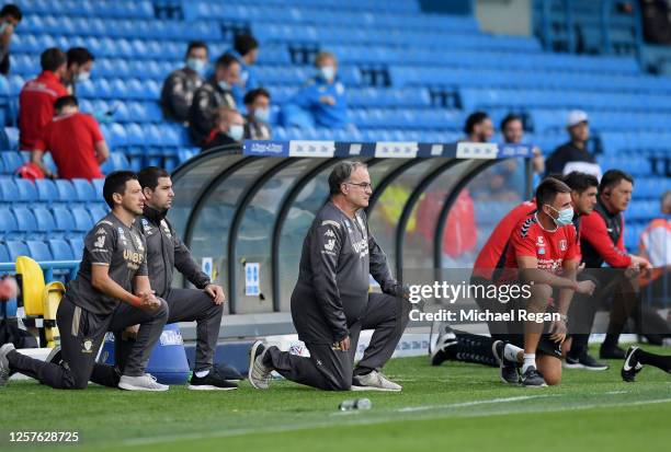 Marcelo Bielsa, Manager of Leeds United takes a knee in support of the Black Lives Matter movement during the Sky Bet Championship match between...