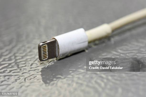 torn mobile device charger cable - mobile phone charger stock pictures, royalty-free photos & images