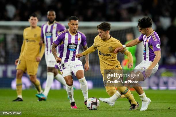 Gavi central midfield of Barcelona and Spain and Alvaro Aguado central midfield of Real Valladolid and Spain compete for the ball during the LaLiga...