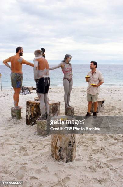 Survivor: Borneo; Survivor: Pulau Tigua. Season One. Richard Hatch, Rudy Boesch and Kelly Wiglesworth tempted by orange slices held by Jeff Probst in...
