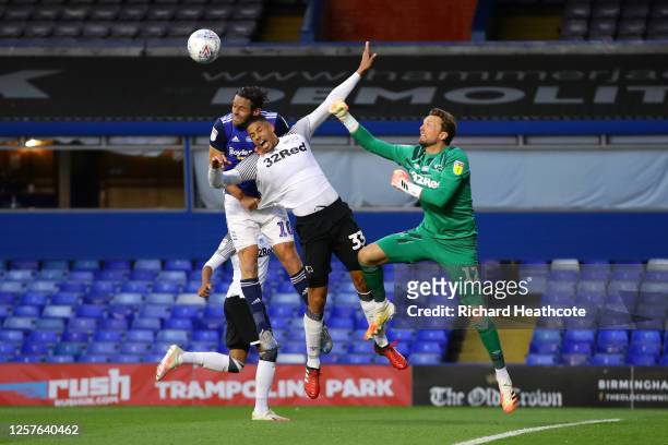 Lukas Jutkiewicz of Birmingham City, George Thorne and Ben Hamer of Derby County battle for posession during the Sky Bet Championship match between...