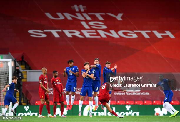 Trent Alexander-Arnold of Liverpool scores his team's second goal from a free kick during the Premier League match between Liverpool FC and Chelsea...