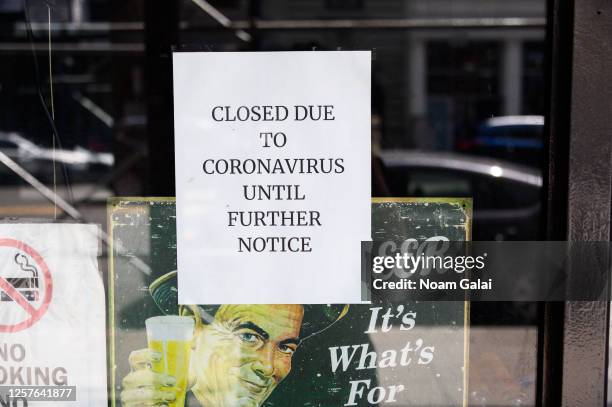 Sign is posted in a bar that reads, "Closed due to Coronavirus until further notice" as the city enters Phase 4 of re-opening following restrictions...