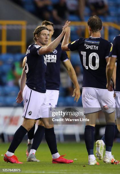 Jon Dadi Bodvarsson of Millwall is congratulated after scoring the fourth goal during the Sky Bet Championship match between Millwall and...