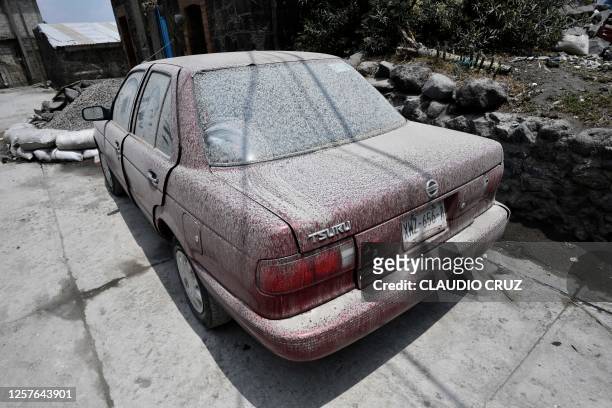 View of a car covered with ashes from the Popocatepetl volcano in the village of Santiago Xalitzintla in Puebla state, Mexico on May 23, 2023....