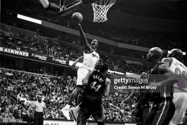 Michael Jordan of the Washington Wizards in action against Brian Grant of the Miami Heat at the MCI Center on March 15th 2003 in Washington DC.