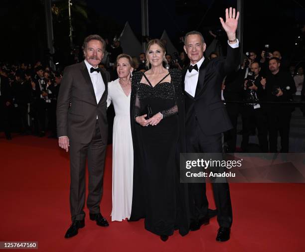 Actor Bryan Cranston, his wife actress Robin Dearden, US actress Rita Wilson and US actor Tom Hanks leave after the premiere of the film Asteroid...