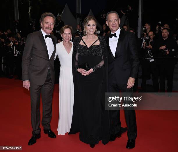 Actor Bryan Cranston, his wife actress Robin Dearden, US actress Rita Wilson and US actor Tom Hanks leave after the premiere of the film Asteroid...