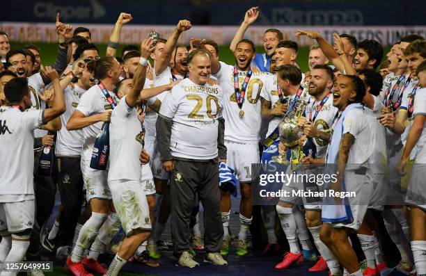 The players of Leeds celebrate their manager Marcelo Bielsa with the trophy during the Sky Bet Championship match between Leeds United and Charlton...