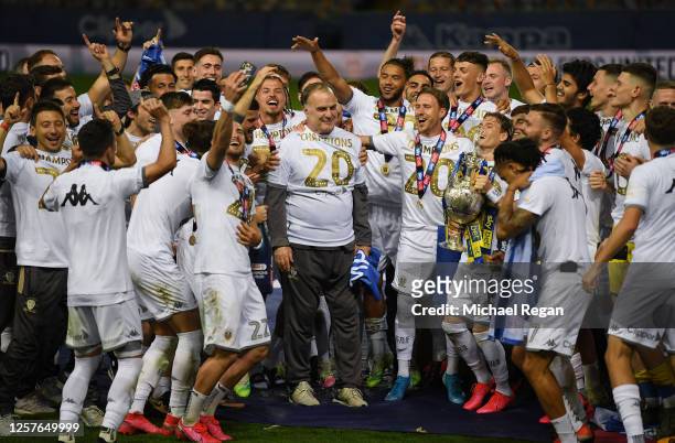 The players of Leeds celebrate their manager Marcelo Bielsa with the trophy during the Sky Bet Championship match between Leeds United and Charlton...