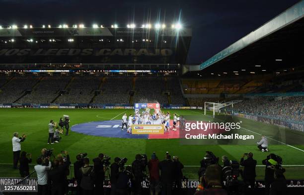 Liam Cooper of Leeds United lifts the trophy in celebration with team mates after the Sky Bet Championship match between Leeds United and Charlton...