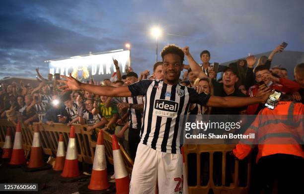 Grady Diangana of West Bromwich celebrate with the fans outside the stadium after the Sky Bet Championship match between West Bromwich Albion and...