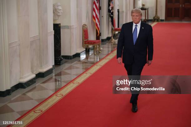President Donald Trump arrives for an event about 'Operation Legend: Combatting Violent Crime in American Cities' in the East Room of the White House...