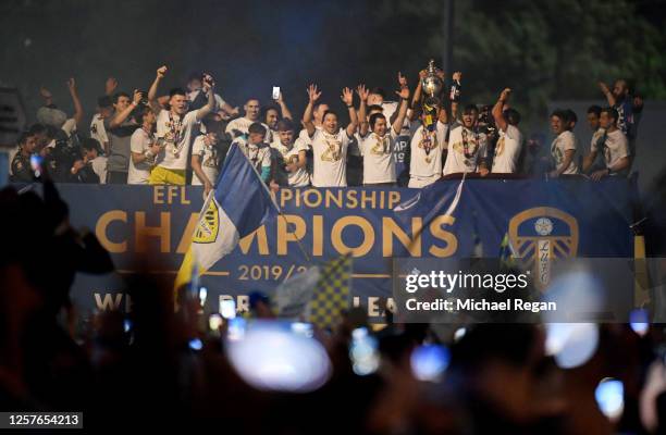 The players of Leeds celebrate with the trophy on a bus outside the stadium after the Sky Bet Championship match between Leeds United and Charlton...