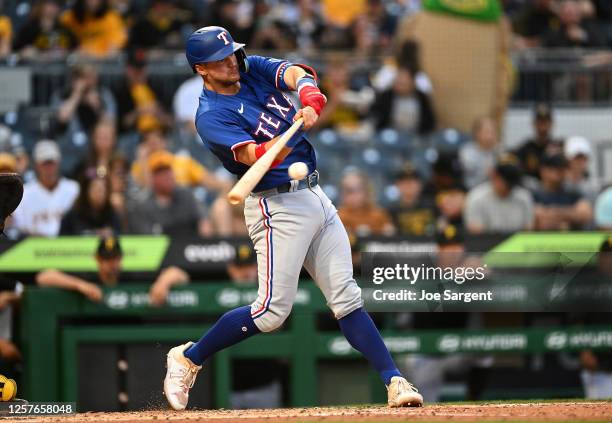 Josh Jung of the Texas Rangers hits a two-run double in the sixth inning against the Pittsburgh Pirates at PNC Park on May 23, 2023 in Pittsburgh,...