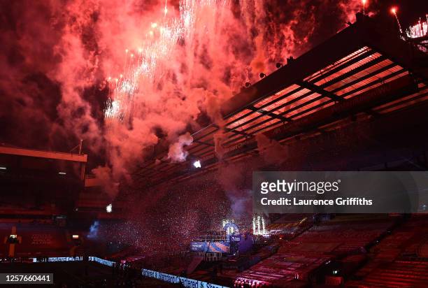 General view inside the stadium as fireworks go off while Jordan Henderson of Liverpool lifts The Premier League trophy following the Premier League...