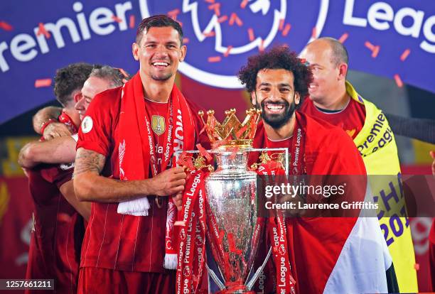 Dejan Lovren of Liverpool and Mohamed Salah of Liverpool pose for a photo with The Premier League trophy following the Premier League match between...