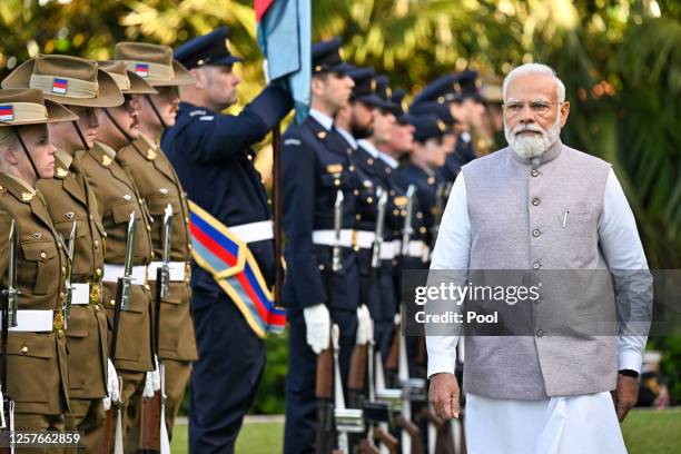 India's Prime Minister Narendra Modi inspects a military parade during a ceremonial welcome at Admiralty House on May 24, 2023 in Sydney, Australia....