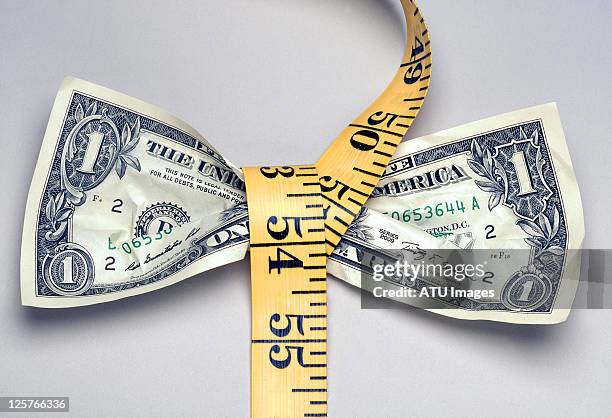 money tape measure - squeezing stock pictures, royalty-free photos & images