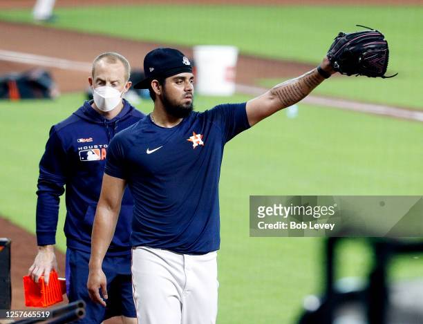 Roberto Osuna of the Houston Astros walks to the dugout after a rehab session during Summer Workouts at Minute Maid Park on July 19, 2020 in Houston,...