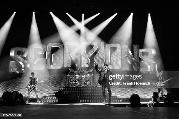 Rudolf Schenker, Klaus Meine and Matthias Jabs of the German band Scorpions perform live on stage during a concert at the Mercedes-Benz Arena on May...