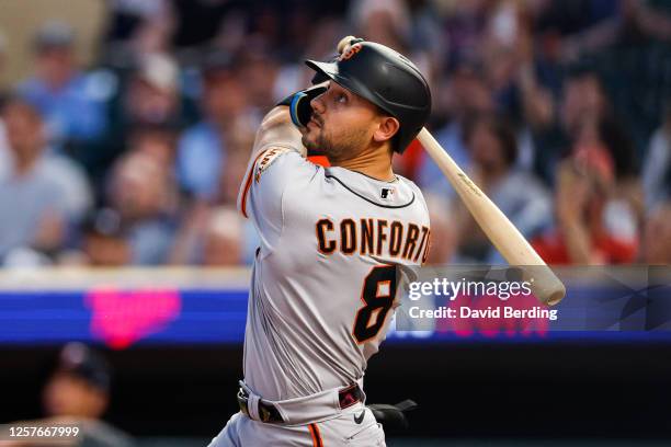 Michael Conforto of the San Francisco Giants hits a two-run home run against the Minnesota Twins in the seventh inning at Target Field on May 23,...