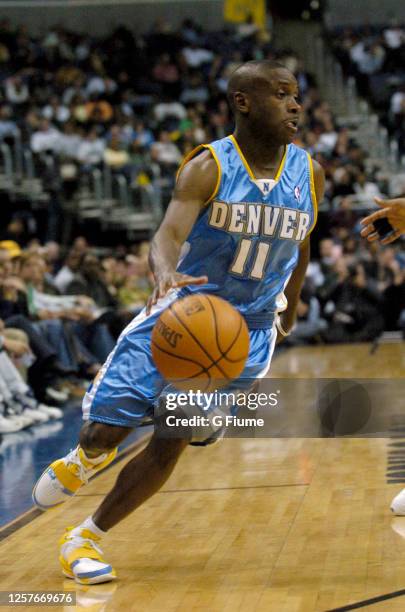 Earl Boykins of the Denver Nuggets handles the ball against the Washington Wizards on November 22, 2005 at the MCI Center in Washington, DC. NOTE TO...