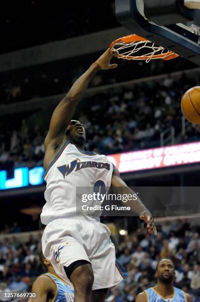 Gilbert Arenas of the Washington Wizards dunks the ball against the Denver Nuggets on November 22, 2005 at the MCI Center in Washington, DC. NOTE TO...
