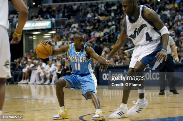 Earl Boykins of the Denver Nuggets handles the ball against Antawn Jamison of the Washington Wizards on November 22, 2005 at the MCI Center in...