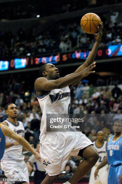 Gilbert Arenas of the Washington Wizards drives to the hoop the ball against the Denver Nuggets on November 22, 2005 at the MCI Center in Washington,...
