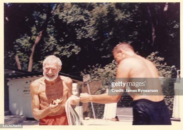 Author Ernest Hemingway poses for a photo with Bob Rynearson at the Rynearson family home in June 1961 in Rochester, Minnesota.