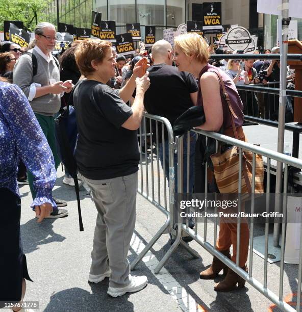 Christine Marinoni and Cynthia Nixon are seen attending the Writers Guild of America strike outside the NBC Building on May 23, 2023 in New York City.