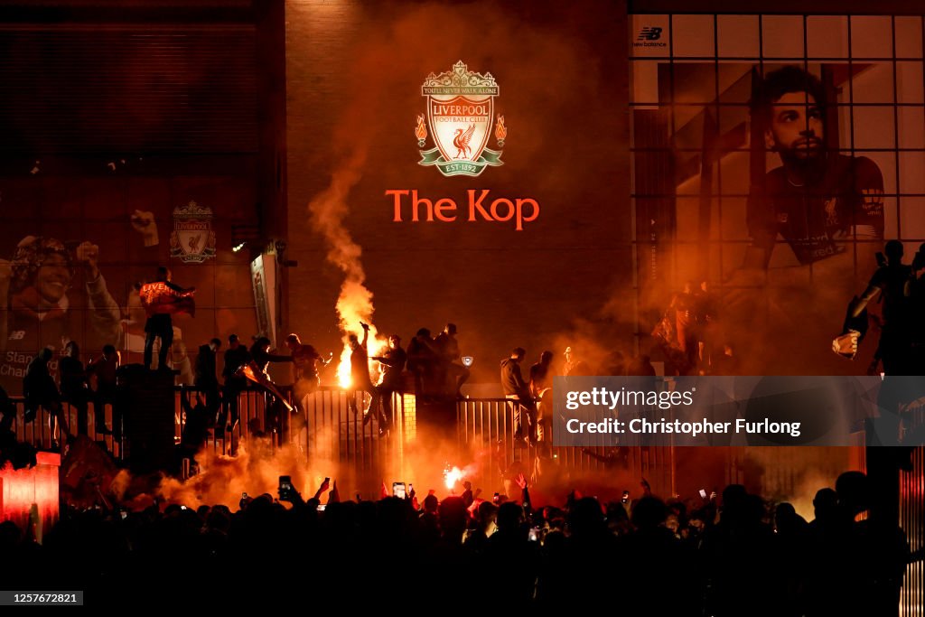Fans Celebrate As Liverpool FC Lift The Premiership Trophy At Anfield