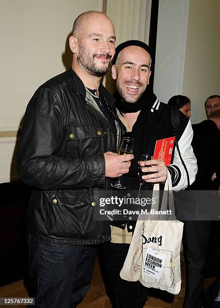 Jake Chapman and Richard Sloan arrive at the James Small Menswear Spring/Summer 2012 runway show during London Fashion Week at Vauxhall Fashion Scout...