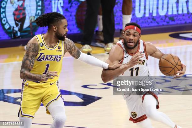 Denver Nuggets forward Bruce Brown drives on Los Angeles Lakers guard D'Angelo Russell during the Denver Nuggets versus the Los Angeles Lakers in...