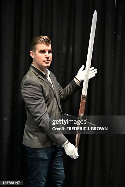 Brandon Alinger, Chief Operating Officer at Propstore, displays the the Scottish Claymore Sword Mel Gibson used as William Wallace in the 1995 film...