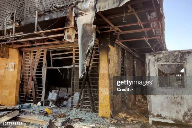 Burnt-down branch of a bank is pictured in southern Khartoum on May 24, 2023. Sporadic artillery fire still echoed in Sudan's capital on May 24 but...