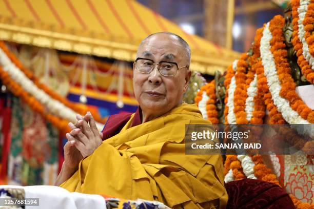 Tibetan spiritual leader Dalai Lama attends a prayer ceremony offered to him for his long life at the Main Tibetan Temple in McLeod Ganj on May 24,...